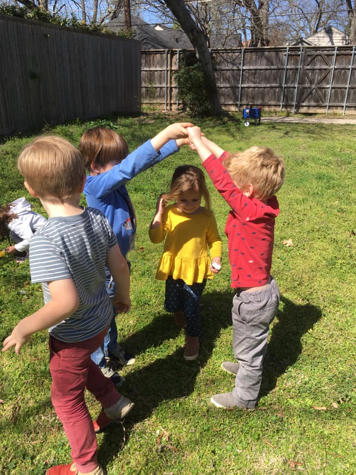 Children playing London Bridge